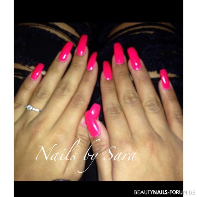 Long neon pink nails